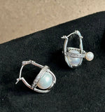 Saturn Whispers Cosmic Pearl Ear Studs - Dynamic Designer Jewelry for Everyday Elegance